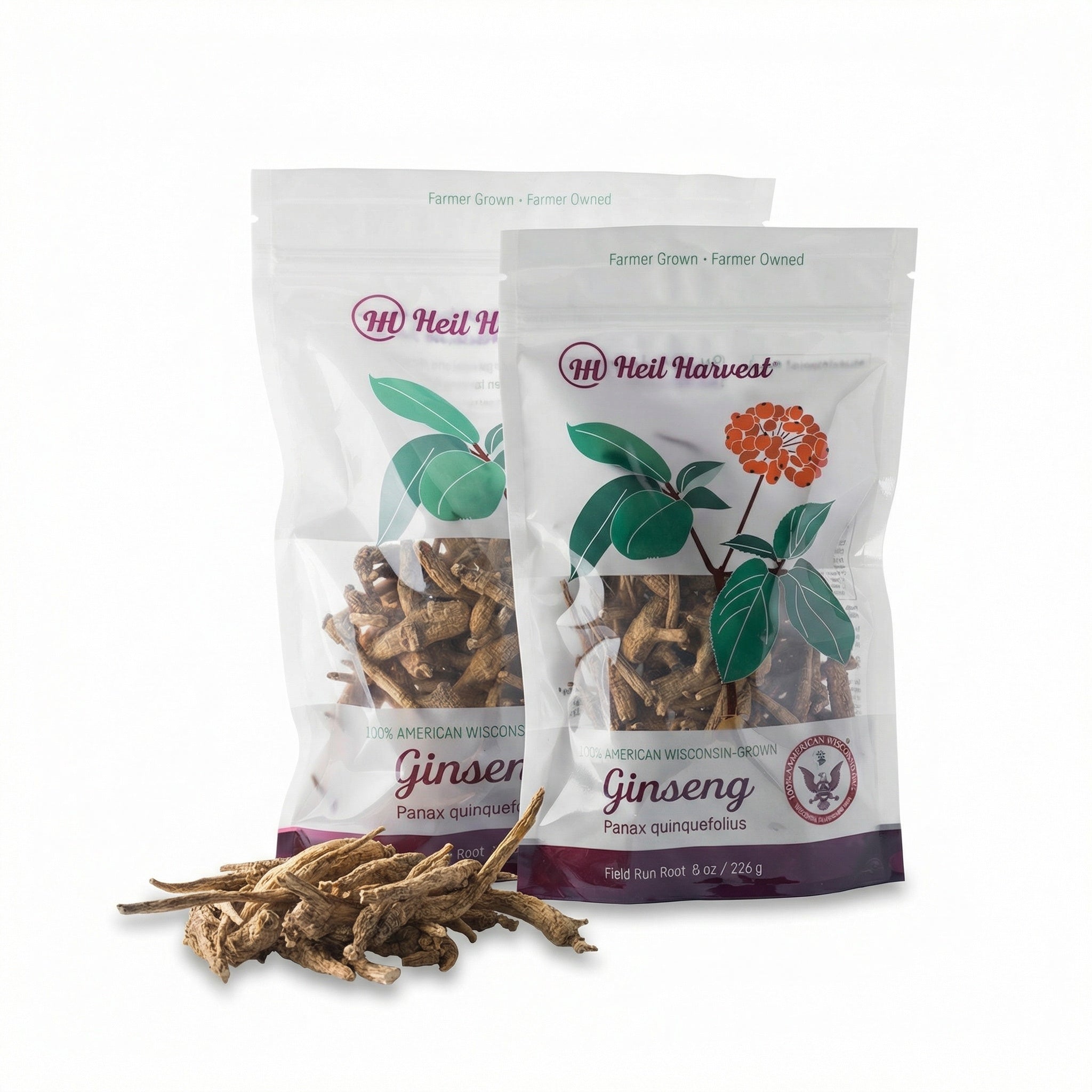 Two resealable bags of Heil Harvest Wisconsin whole ginseng root beside a small pile of dried roots
